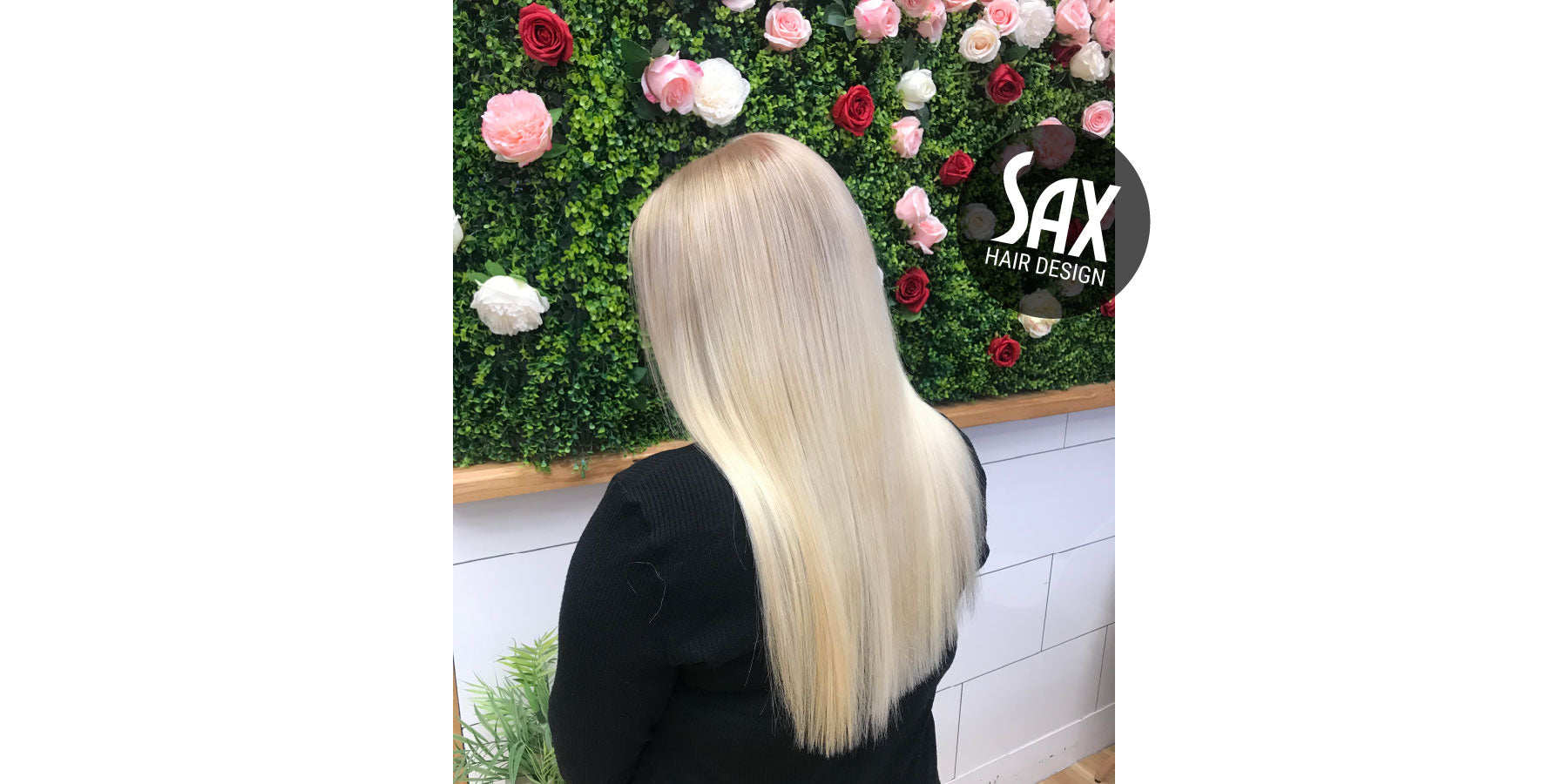 Photo of client with long blonde hair, after appointment at Sax Hair Design.