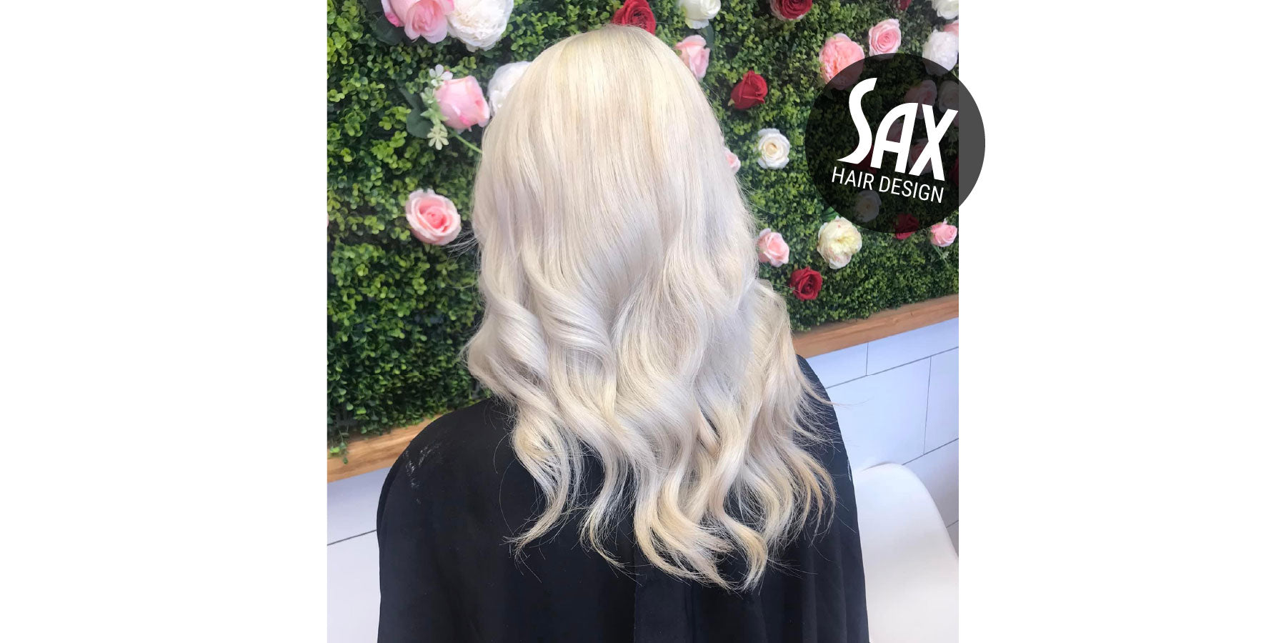 Photo of client with long white blonde hair, after appointment at Sax Hair Design.