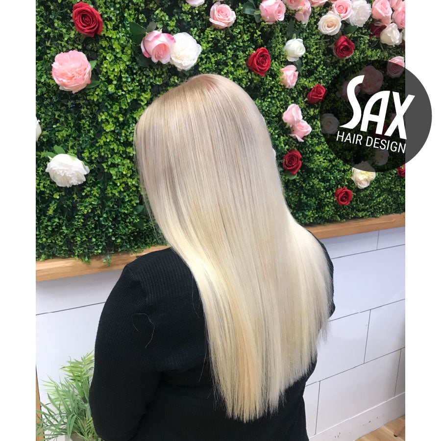 Photo of client with long blonde hair, after appointment at Sax Hair Design.