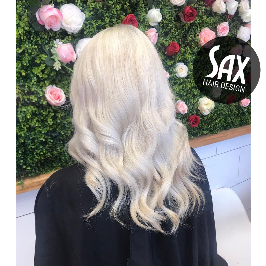 Photo of client with long white blonde hair, after appointment at Sax Hair Design.