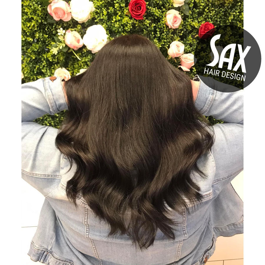 Photo of client with long black hair, after appointment at Sax Hair Design.