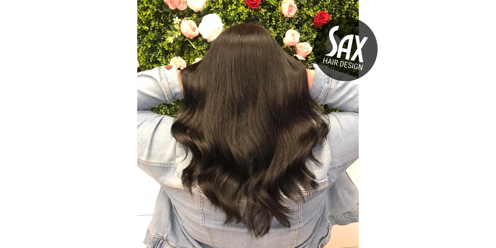 Photo of client with long black hair, after appointment at Sax Hair Design.